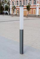 Street lamppost, LED lighting, frosted round glass, stylish street lighting design. photo