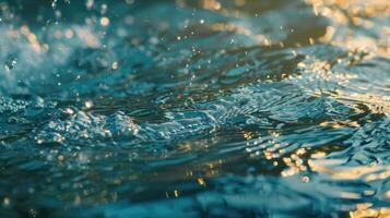 borroso azul agua superficie con burbujas olas y luz de sol. foto