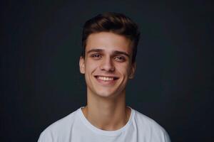 Handsome young man in white t shirt studio portrait. photo