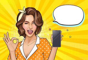 Pop art girl holding mobile phone. Winking woman showing screen of new smartphone and OK sign. Pretty lady on yellow background with empty speech bubble. illustration for digital advertisement. vector