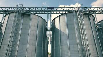 tanks for processing and storage of soybean and wheat grain. Harvesting and processing and storage elevator video