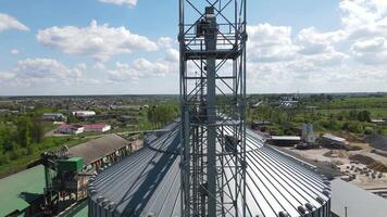 tanks for processing and storage of soybean and wheat grain. Harvesting and processing and storage elevator video