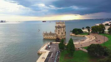 Aerial drone shot of Belem Tower overlooking cityscape. video