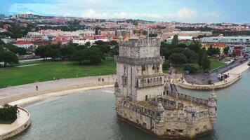 Aerial drone shot of Belem Tower overlooking cityscape. video