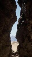 A narrow passage between two large rocks video