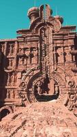 A red clay temple with intricate ornamented walls video