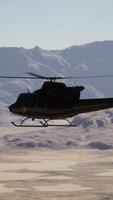 A helicopter is flying over a mountain range video