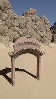 A small arch in the middle of a desert video