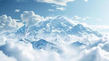 Majestic snowy mountain peak above the clouds photo