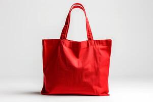 eco simpático rojo lona totalizador bolso en blanco antecedentes. diseño modelo para Bosquejo , foto