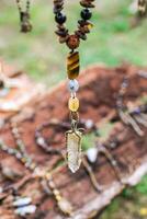 Handcraft necklace made from metal and stones on a market. Handcraft precious item. Jewelry accessories. photo