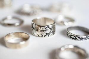 Collection of handmade silver rings with natural texture. Handcraft precious item. photo