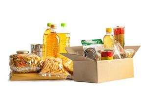 Foodstuff for donation, storage and delivery. Various food, pasta, cooking oil and canned food in cardboard box. photo