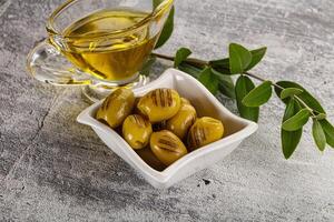 Grilled green olives appetizer snack photo