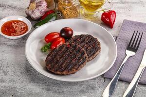 Grilled burger cutlet with sauce photo