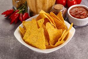 Mexican corn nachos chips with salsa photo
