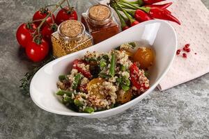 Vegan boiled quinoa with vegetables photo