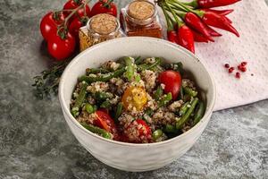 Vegan boiled quinoa with vegetables photo