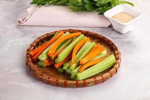 Vegan cuisine - dietary celery and carrot cticks photo