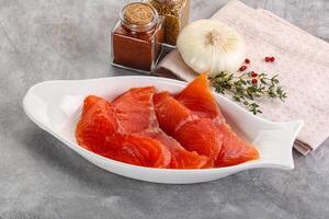 Salted raw salmon fillet appetizer photo