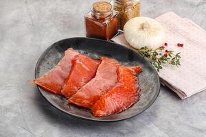 Salted raw salmon fillet appetizer photo