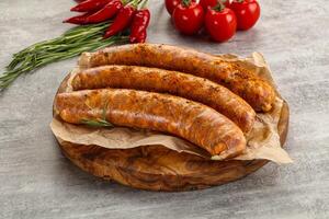 Raw sausages with spices and herbs photo