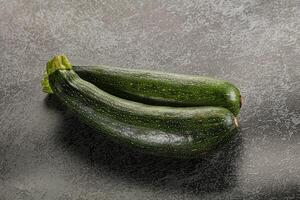Raw young small green zucchini photo