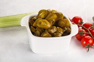 Sliced canned jalapeno pepper photo