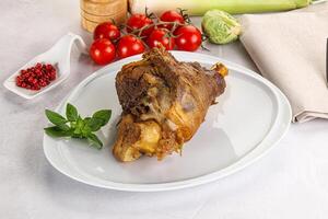 Baked Lamb shank with bone photo