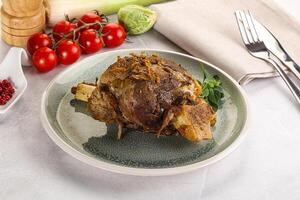 Baked Lamb shank with bone photo