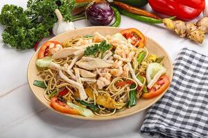 Fried noodles with prawn and vegetables photo