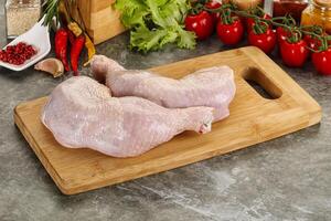 Raw chicken leg foe cooking photo