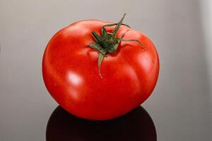 Ripe tasty and juicy tomato isolated photo