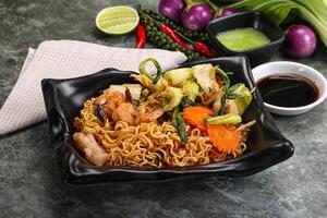 Asian cuisine - Fried noodles with seafood photo