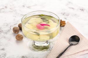 Sweet pineapple jelly with mint photo