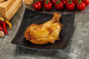 Roasted chicken leg with spices photo