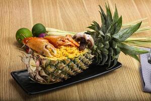 Rice with seafood in pineapple photo