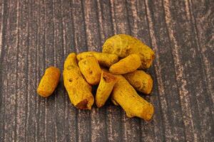 Indian spices - Turmeric root Curcuma photo