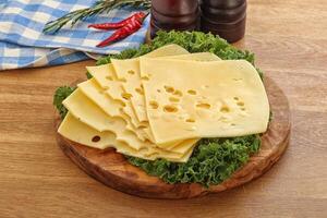 Sliced maasdam cheese for breakfast photo