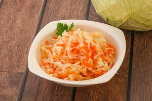 Sauerkraut - pickled cabbage in the bowl photo