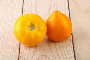 Ripe yellow bright juicy tomato photo