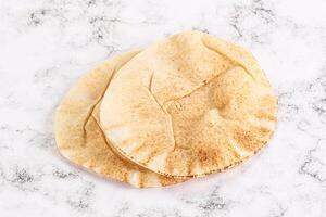 Traditional eastern round pita bread photo