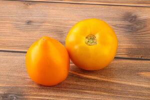 Ripe yellow bright juicy tomato photo