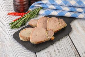 Baked pork tenderloin served rosemary photo