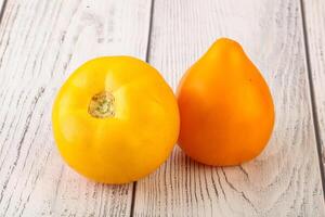 Ripe yellow bright juicy tomato photo