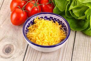 Shredded cheese in the bowl photo