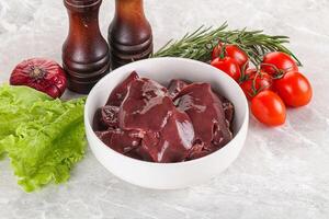 Raw turkey liver in a bowl ready for cooking photo