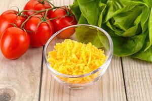Shredded cheese in the bowl photo