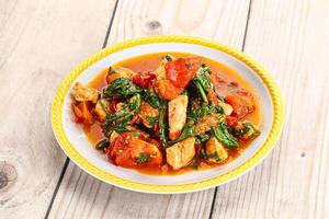 Chicken with tomato and spinach photo