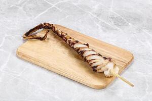 Delicous tasty Grilled octopus tentacle photo